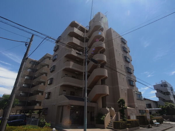 【メゾン橋本】落着きある薄茶系タイル貼の外壁